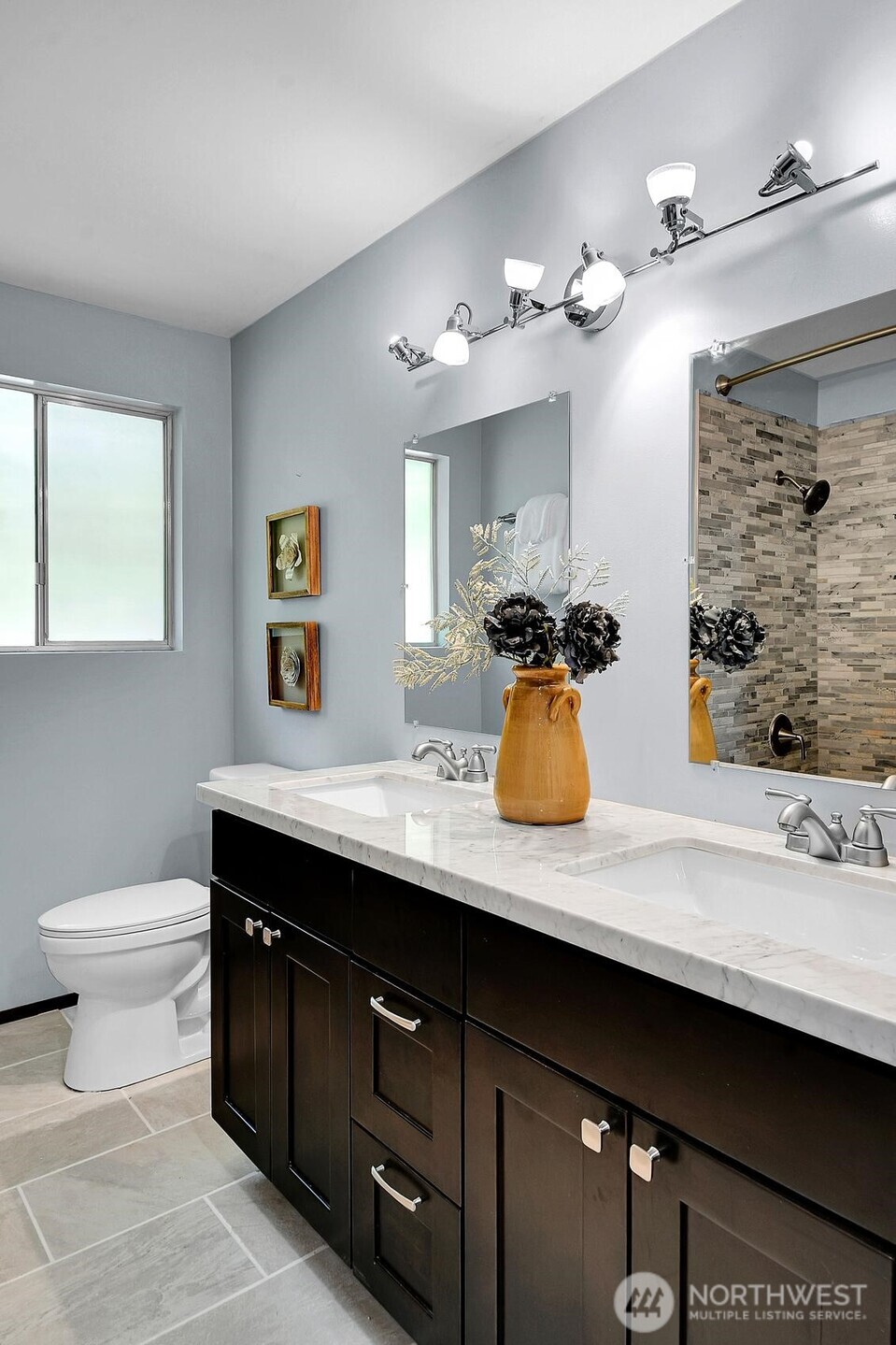 This grand hall bathroom with double sinks makes life easy.