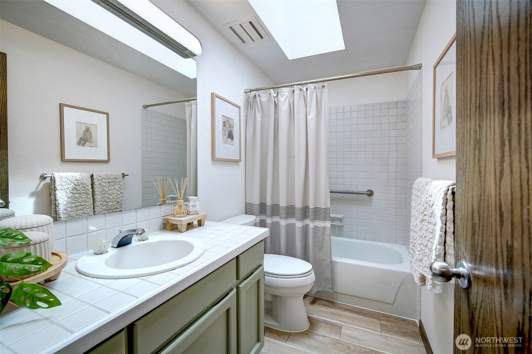 Hallway Bath is flooder with light from skylight