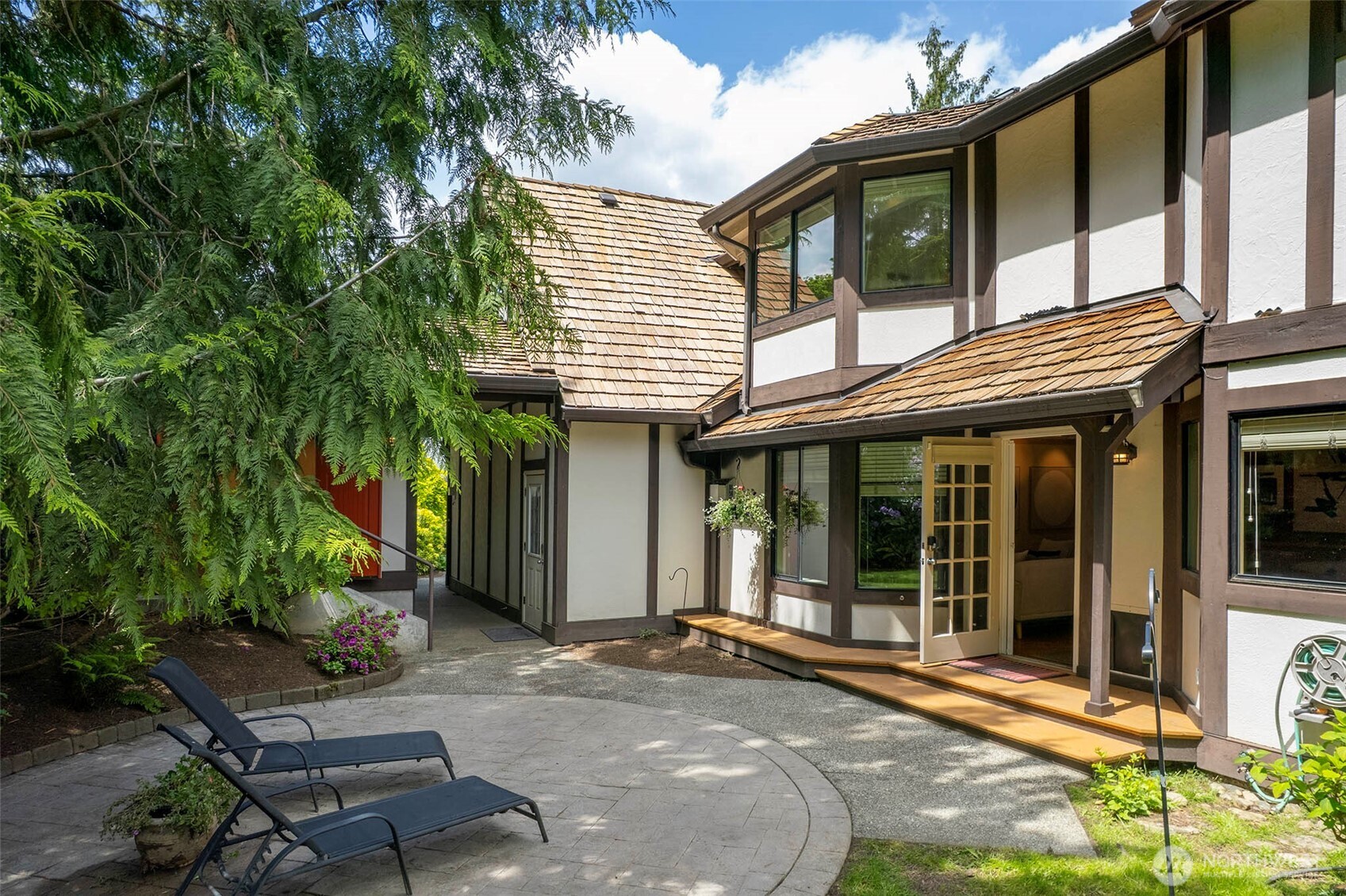 Patio and covered porch lead to the back yard and Studio entrance