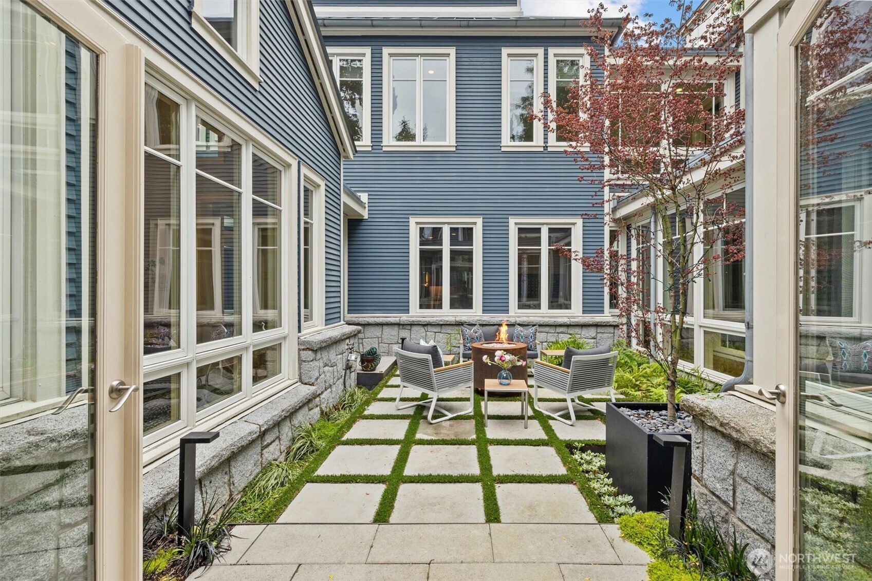 courtyard with fire pit and entertaining space off of dining room