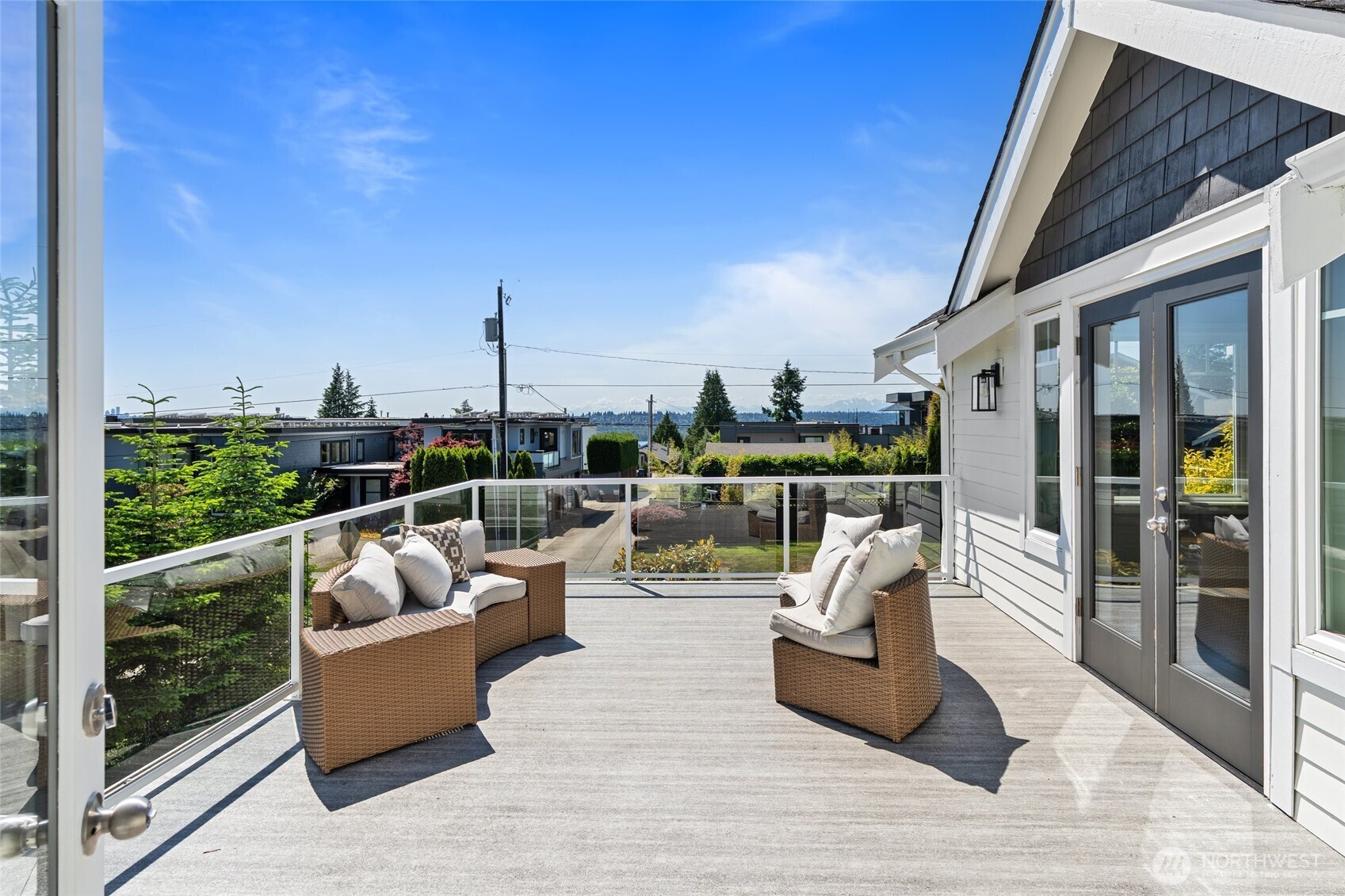 Sun-drenched spacious deck with comfortable seating and serene westerly views—perfect for relaxing and unwinding.