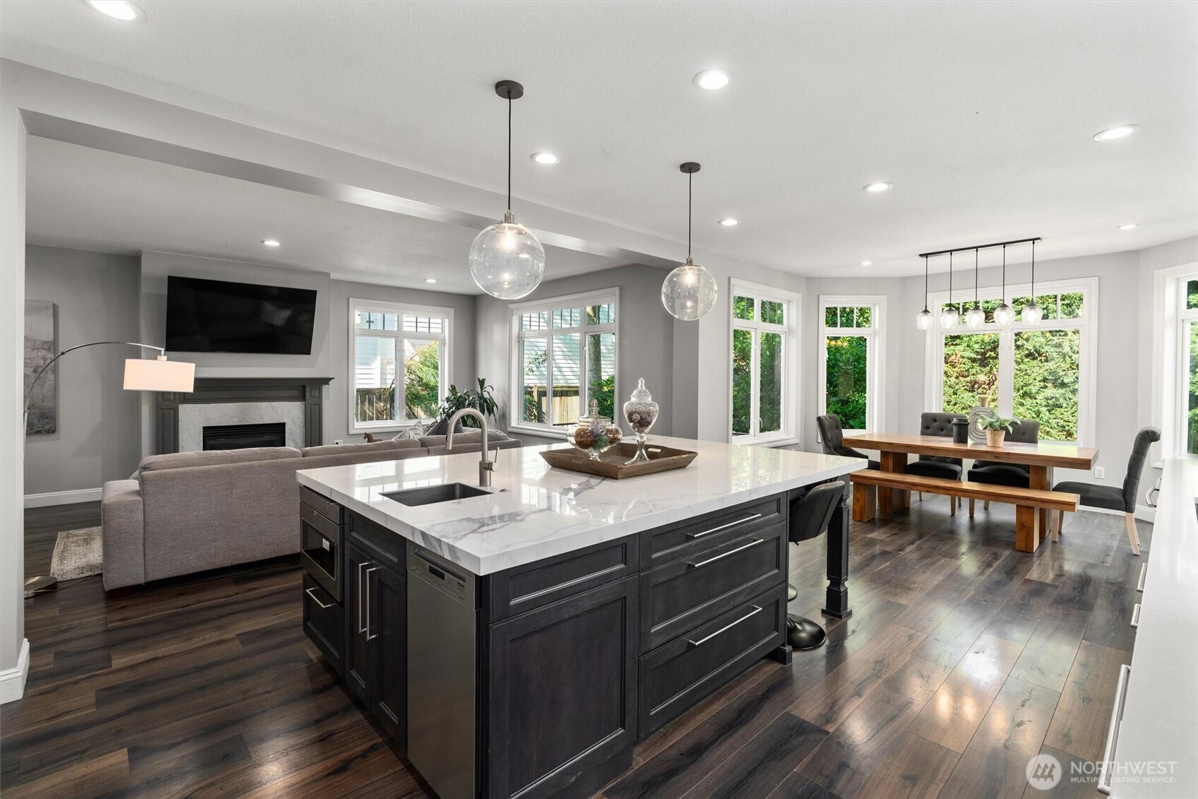 An expansive porcelain island anchors the great room, ideal for entertaining.