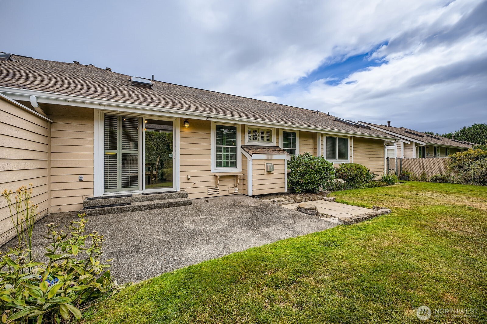 Spacious backyard is fully fenced & mowed by HOA