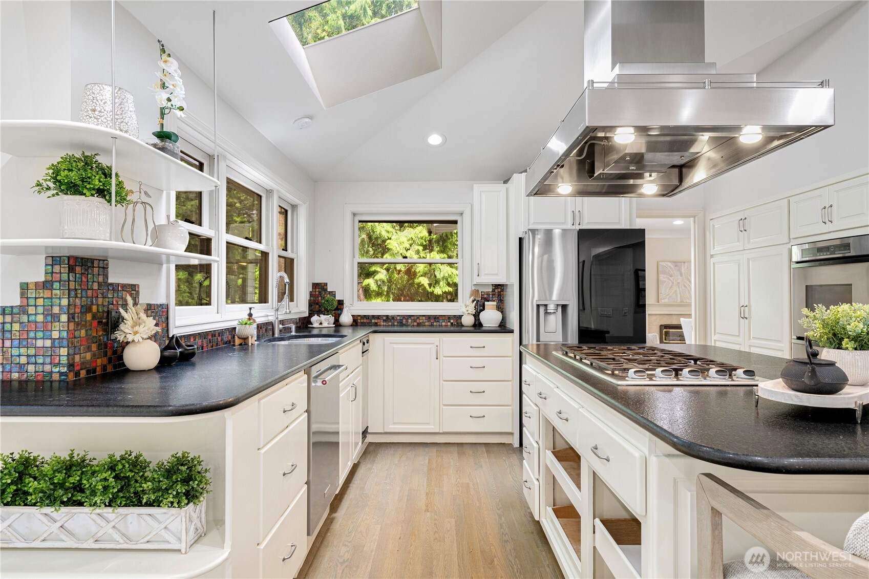 Kitchen has abundant natural light, Showcasing contemporary design and comfortable furnishings