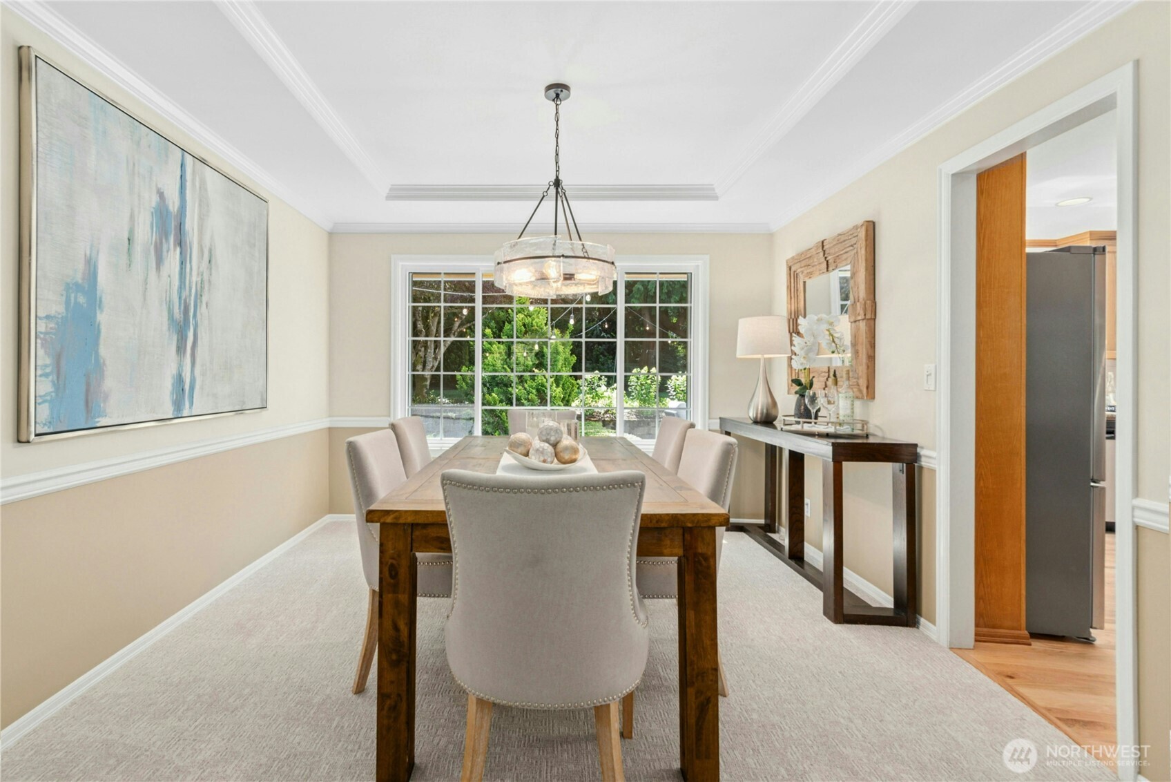 Formal dining room off living room connecting to kitchen.