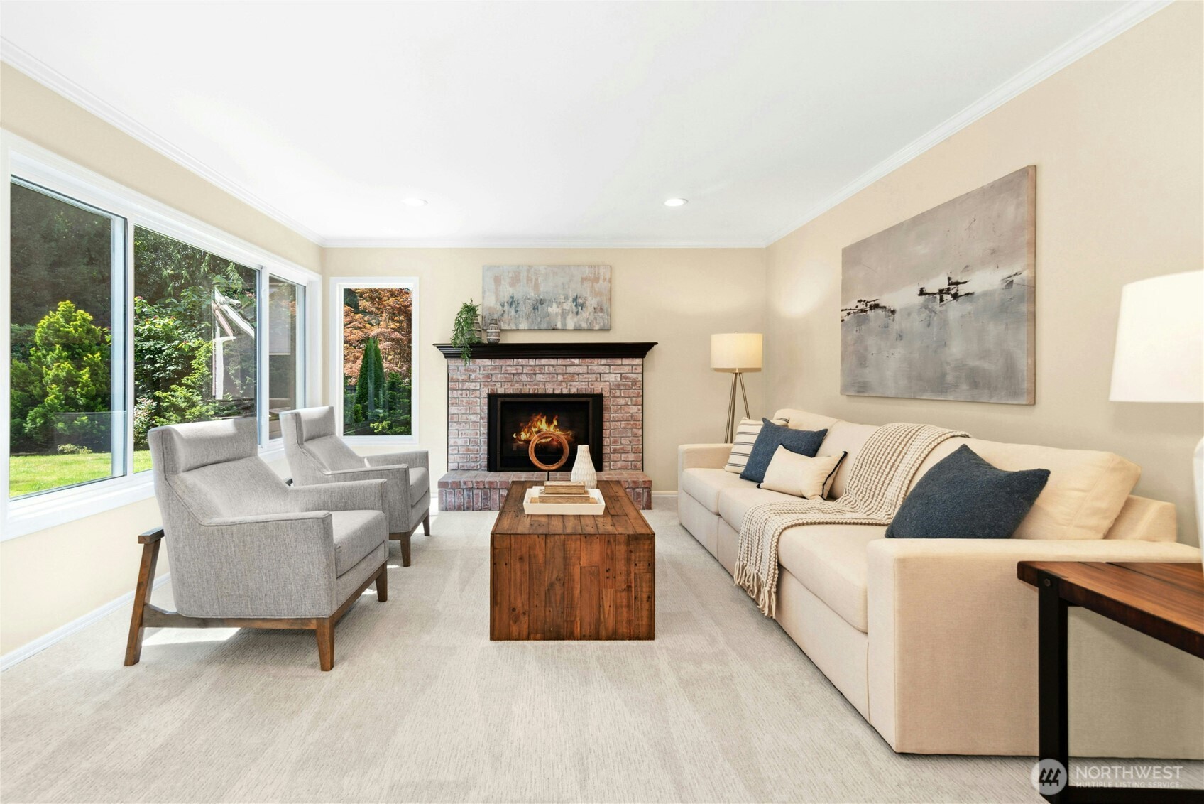 Large family room with gas fireplace and abundance of natural light.