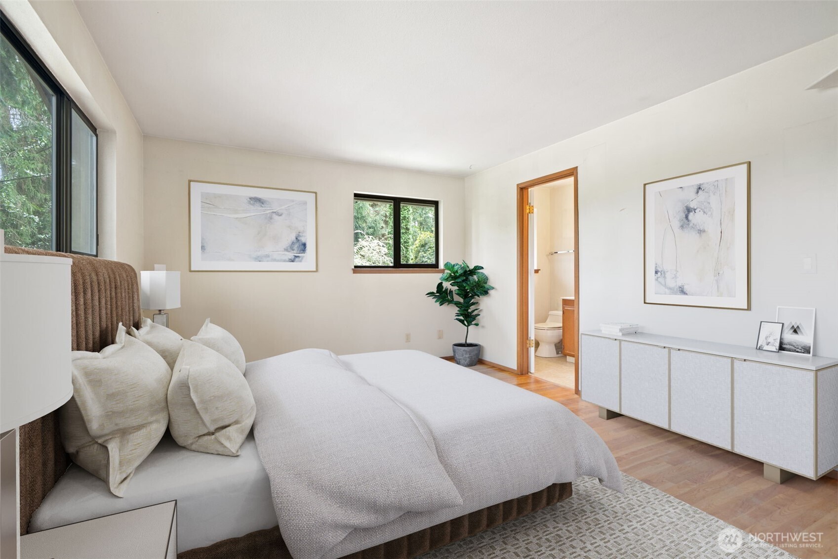 Main level bedroom at front of the home, original hardwoods and private bath with shower. 2 closets also! Virtually staged to show potential of this space!