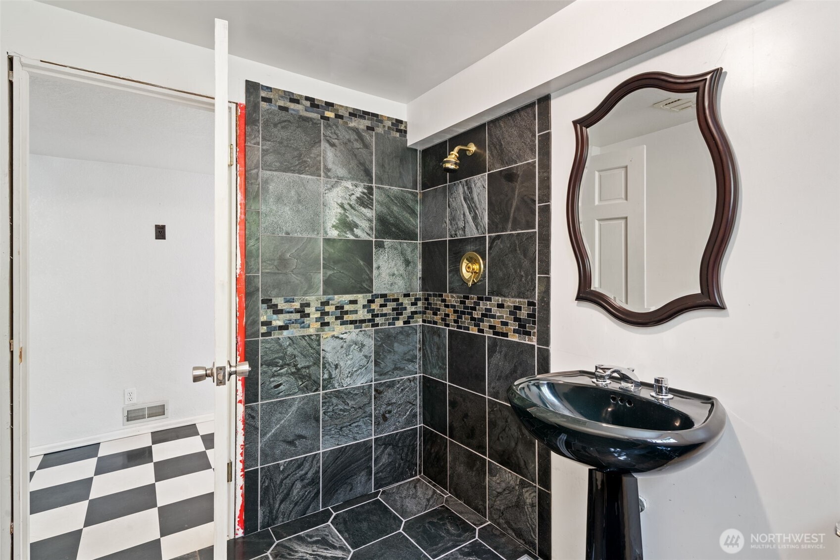 3/4 bathroom on the lower level of the house with shower, toilet & sink.