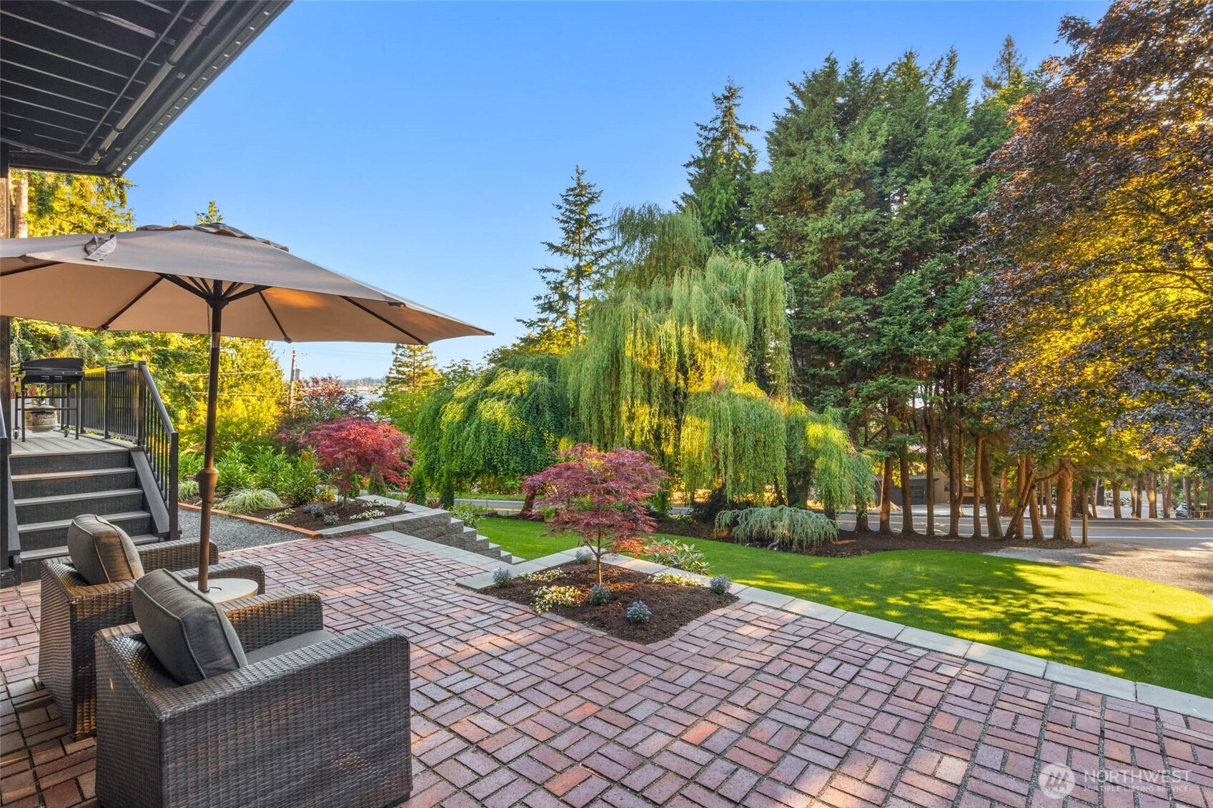 Enjoy these dreamy willowy scenes from your lower paver patio. From there, you'll have easy access to the beach and park just moments away!