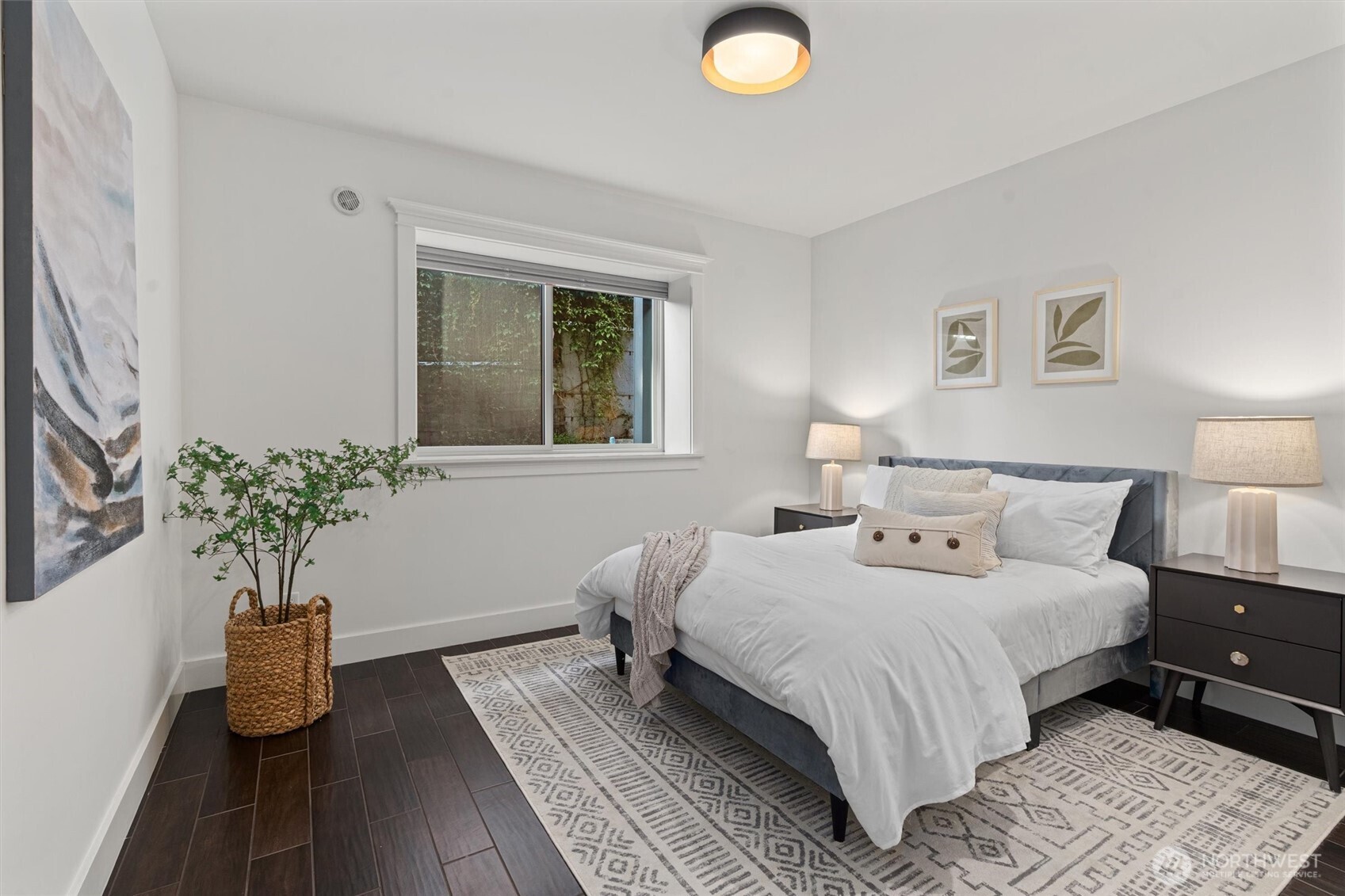 Enjoy ample storage and warmth in the lower-level bedroom, featuring generous closets and radiant heating.