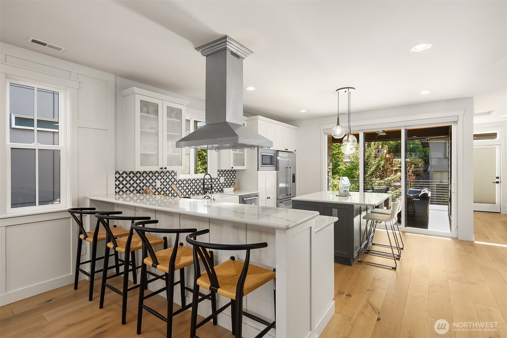 kitchen with sliding doors to covered, heated deck including gas fireplace