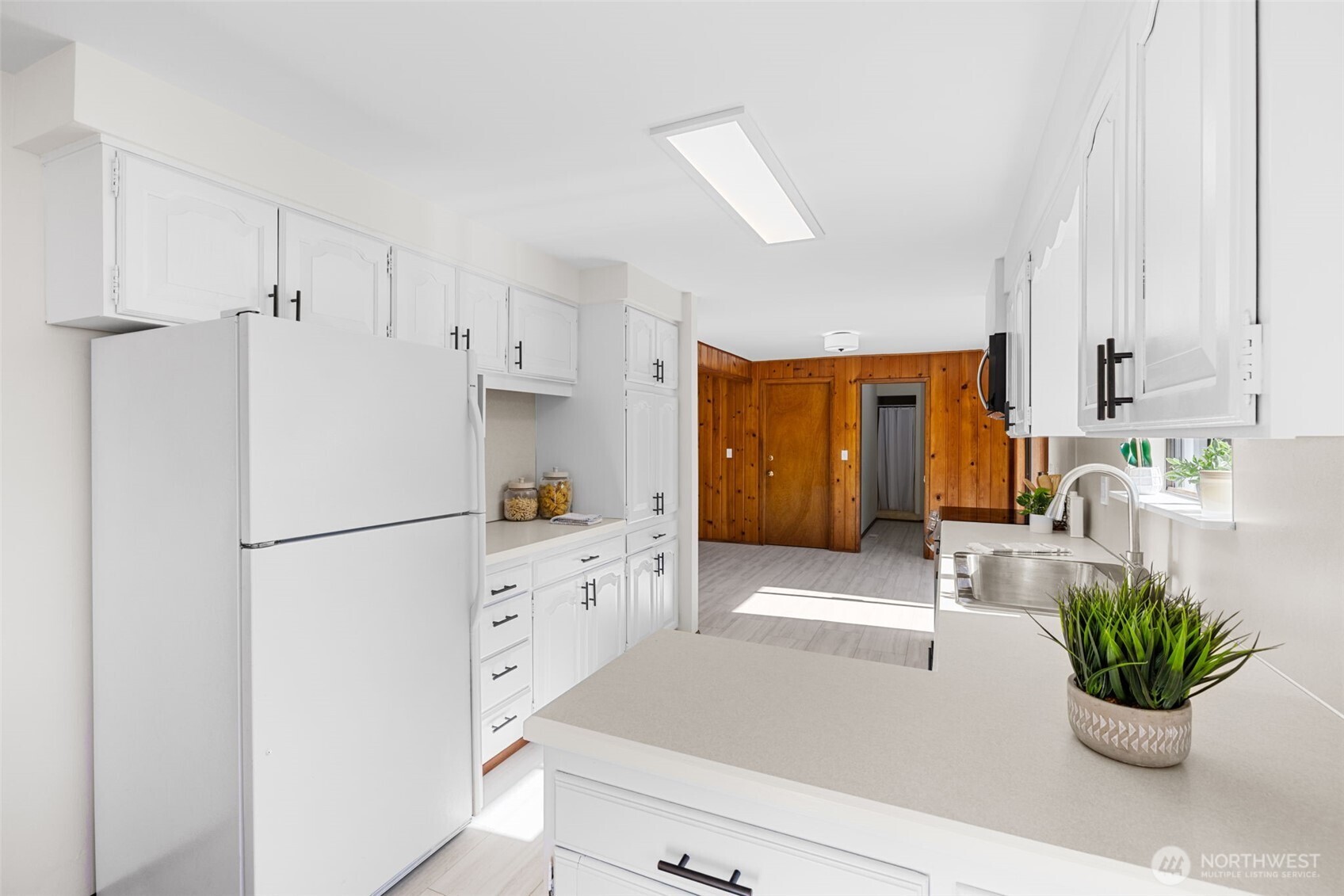 Freshly painted, new flooring, new stove/oven/microwave, barn style ss sink & new faucets, new hardware & lighting