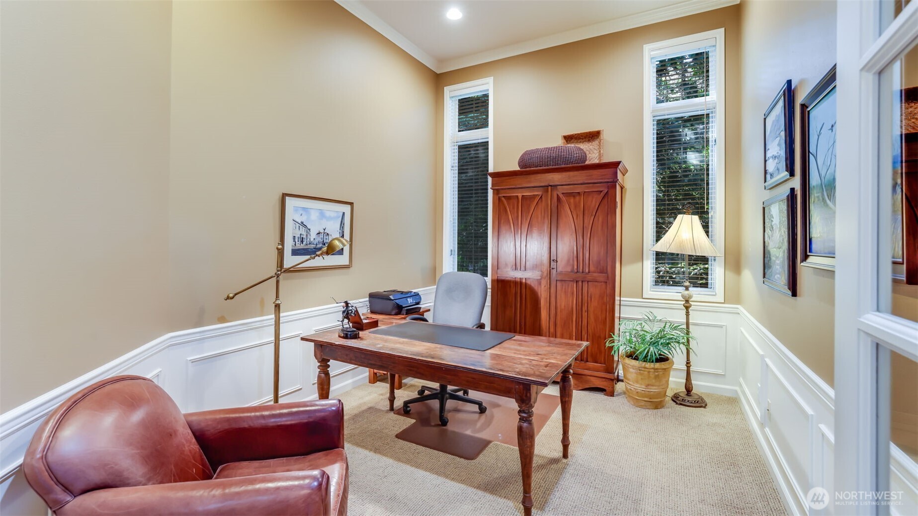 Main level den with lofted ceiling- an ideal work from home space!