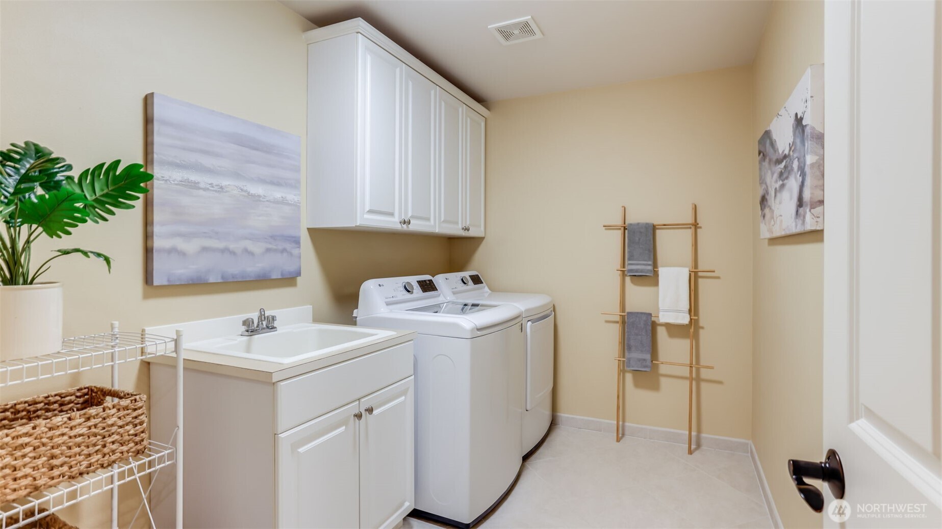 Main floor utility room with storage