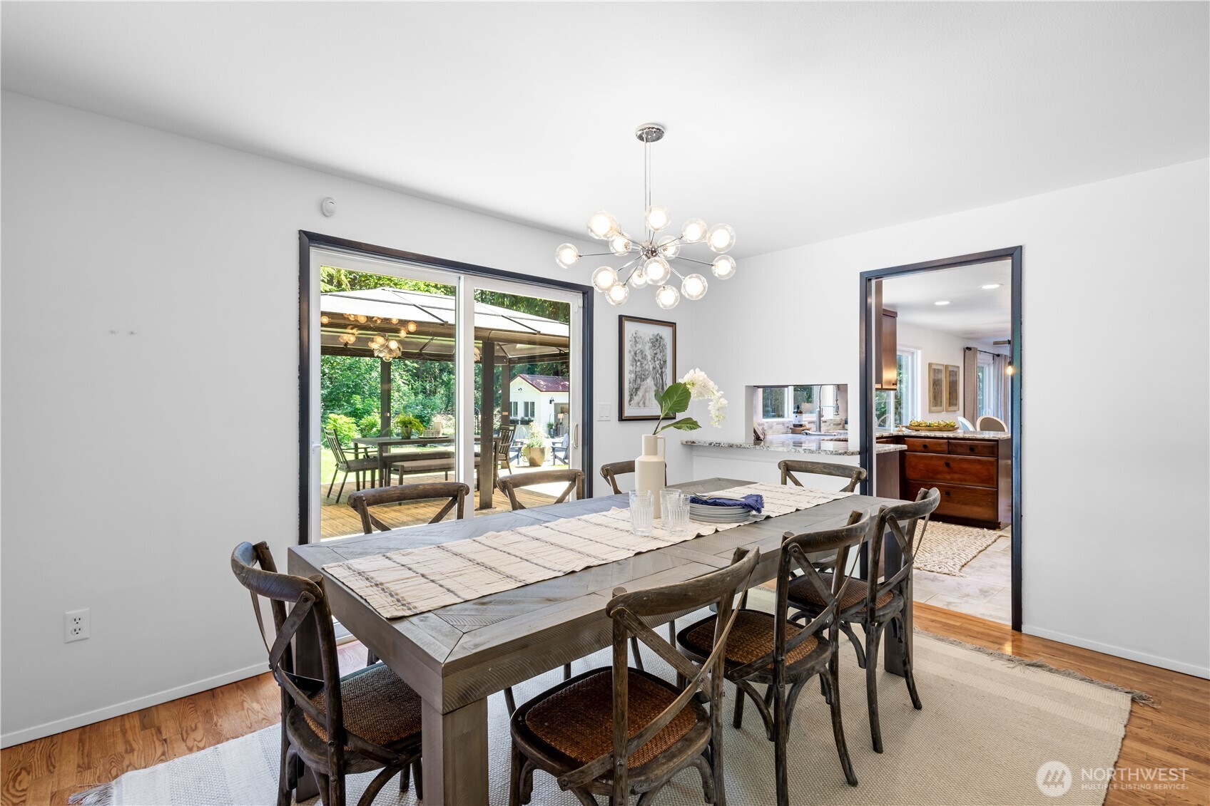 Conveniently located off the kitchen, the formal dining room features sliding doors that open to the backyard—an ideal layout for effortless indoor-outdoor entertaining.