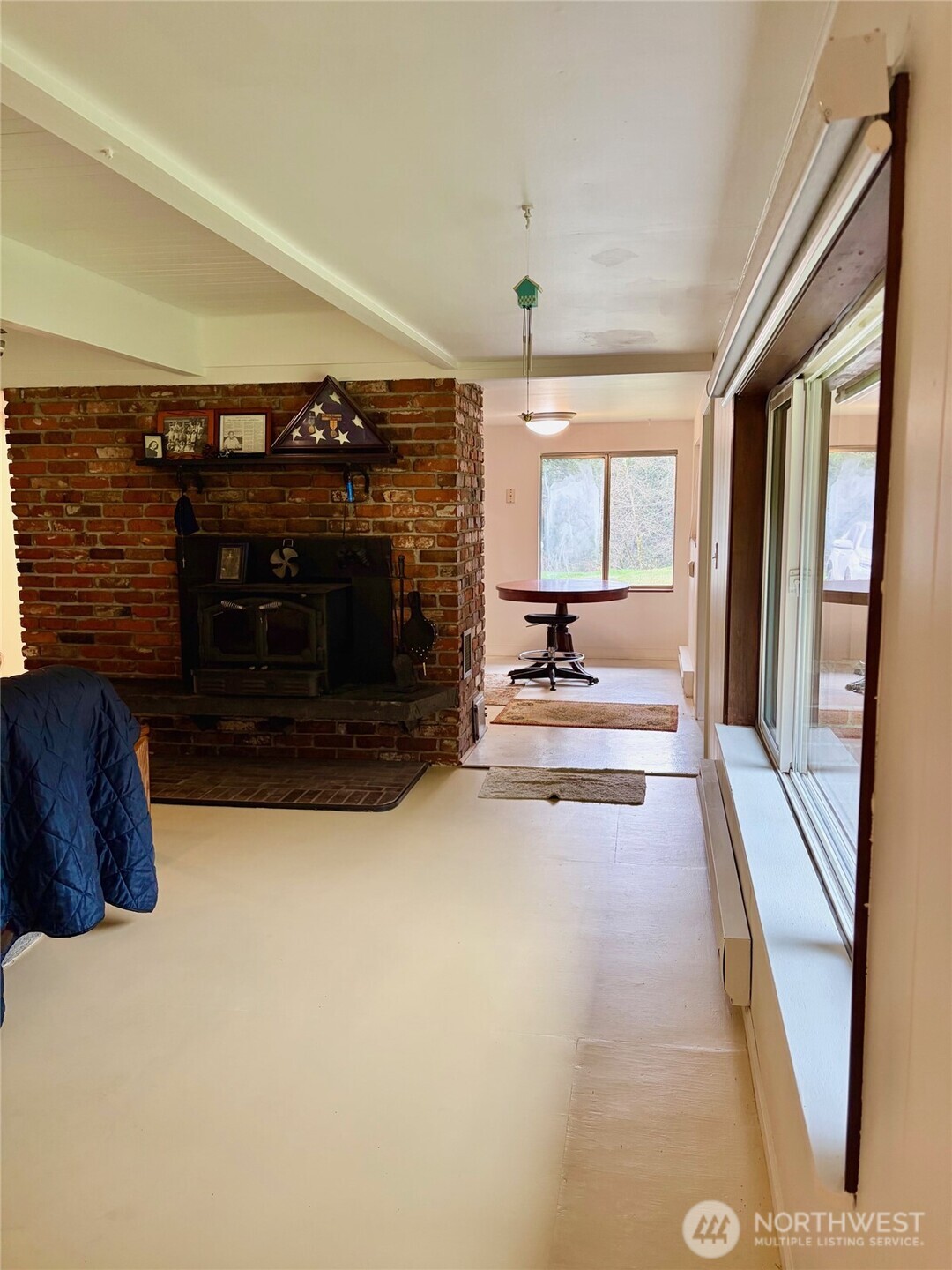 Far Wall of Living Room Features a Spacious CLoset