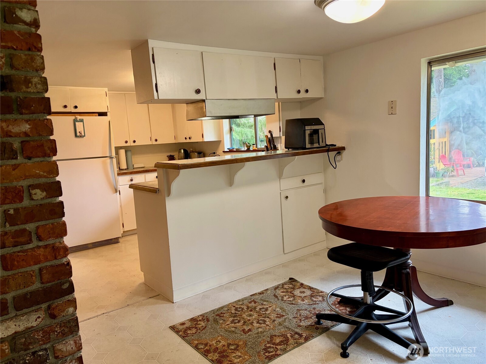 Kitchen with window overlooking the cottage