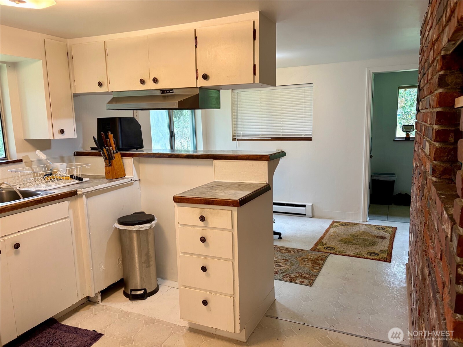 The back side of the fireplace which is the perfect spot for a microwave!