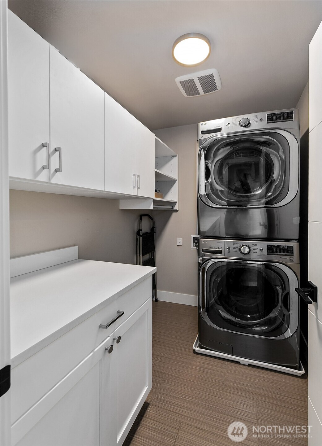 Laundry room with extra space for folding and storage.