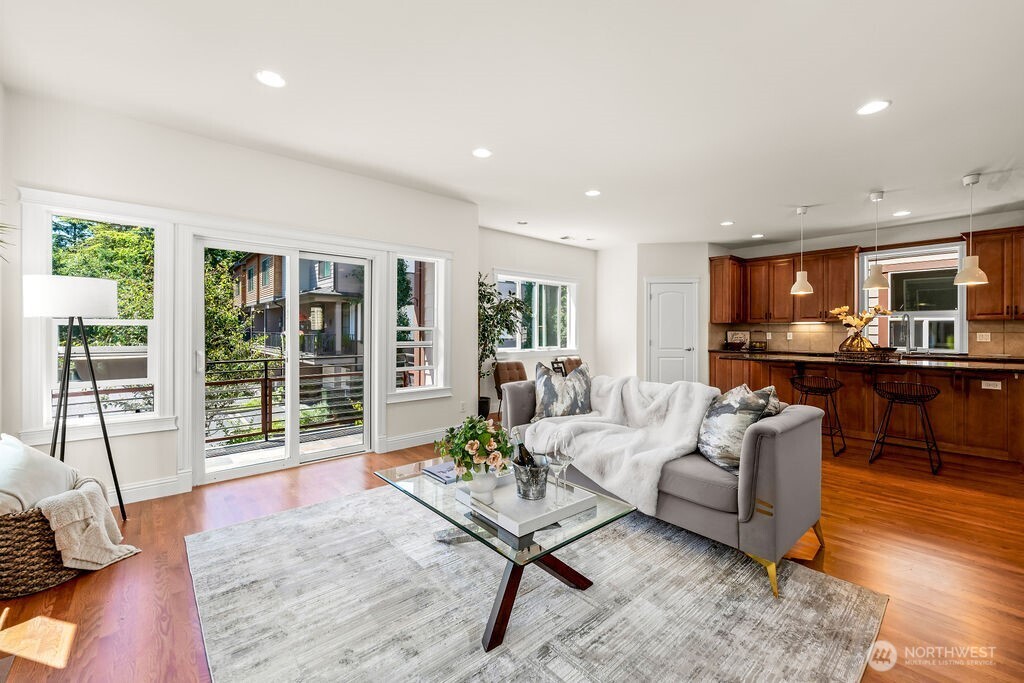 Main floor well-appointed layout: living room with a gas fireplace and a sliding door to a balcony opens to Gourmet kitchen with an entertainment size island and a breakfast nook.