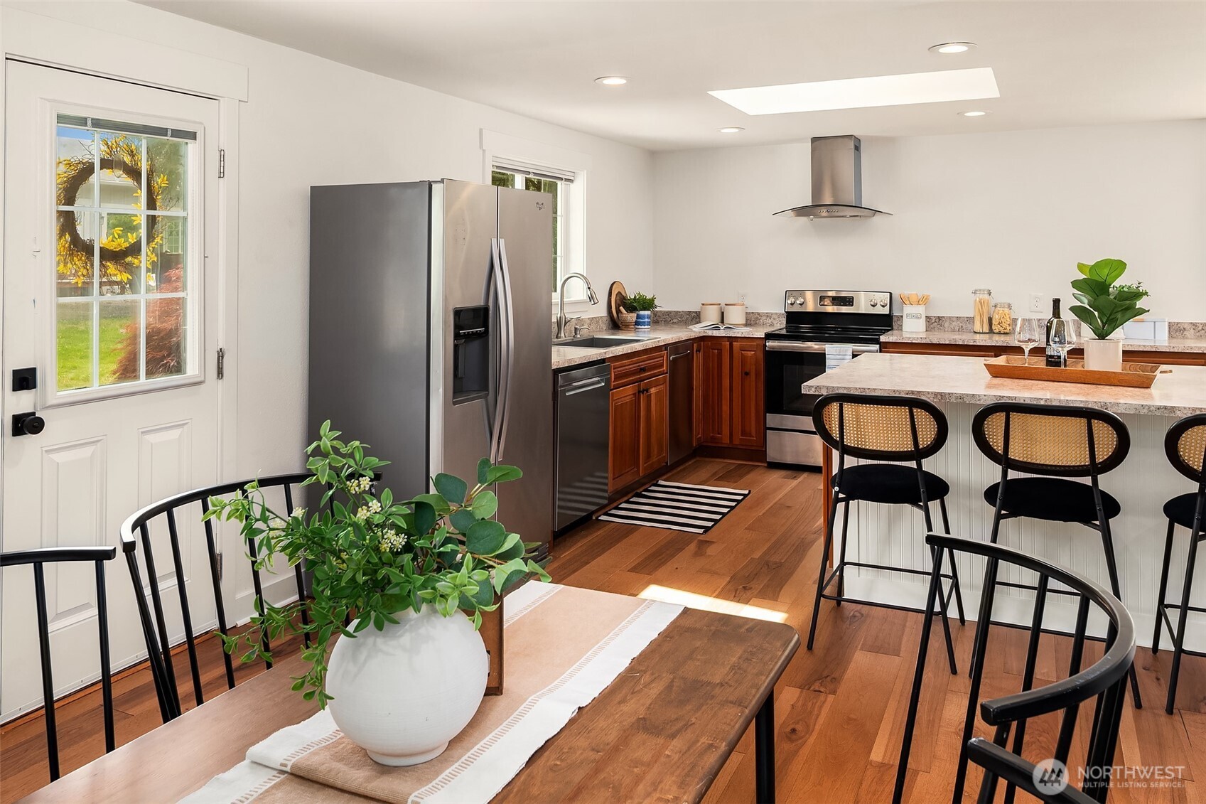 Enjoy main level living with a large eat in kitchen with Canyon Creek solid cherry cabinets, stainless steel appliances and large island.