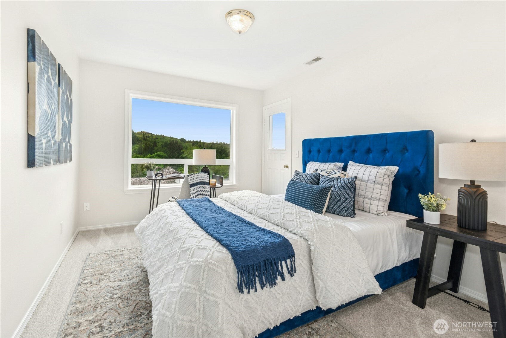 1 of 3 secondary bedrooms upstairs. This one with access to balcony off Primary.