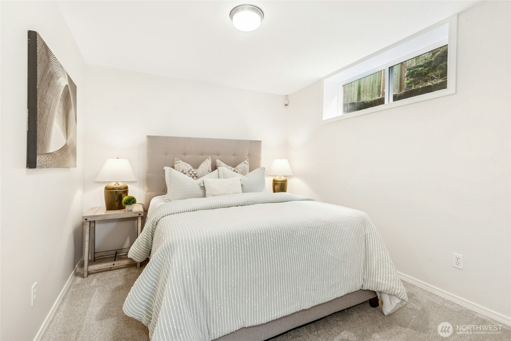 Lower Floor Bedroom with private sitting room and garage access.