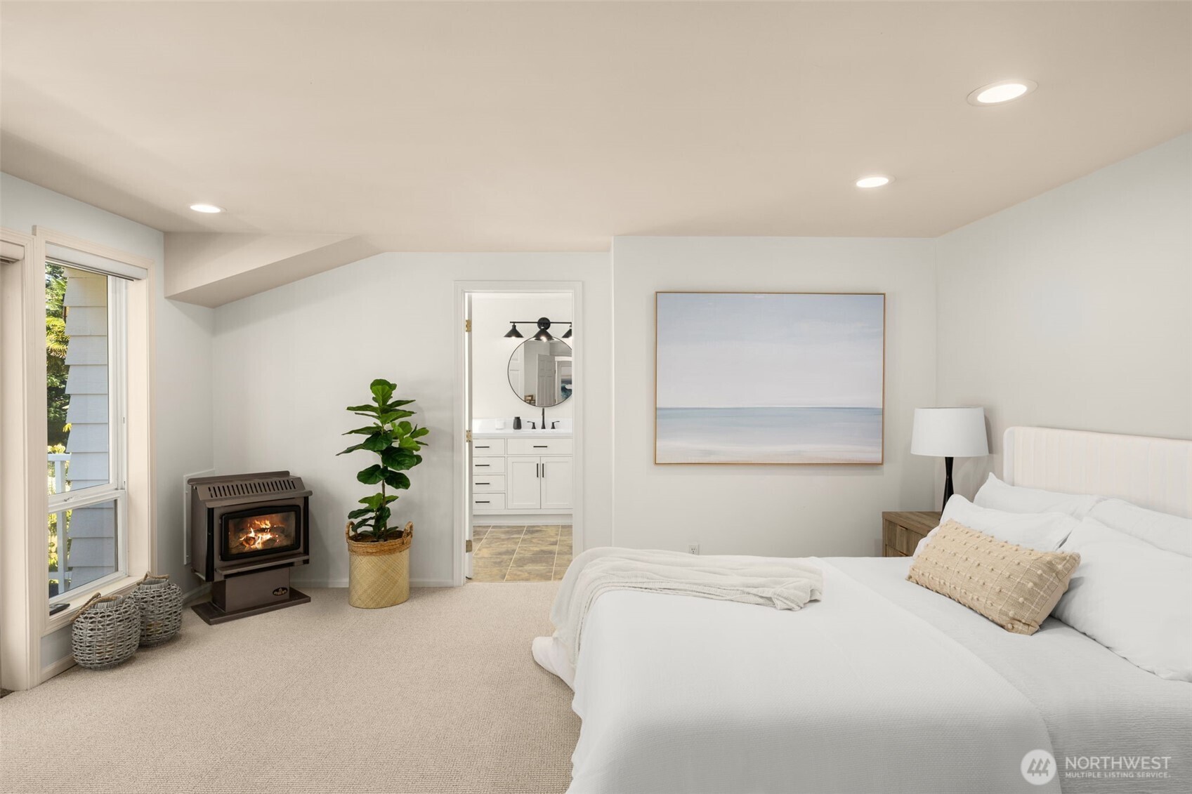 Serenity meets comfort in this dreamy bedroom — complete with glowing fireplace, garden views, and a luxurious ensuite just steps away.