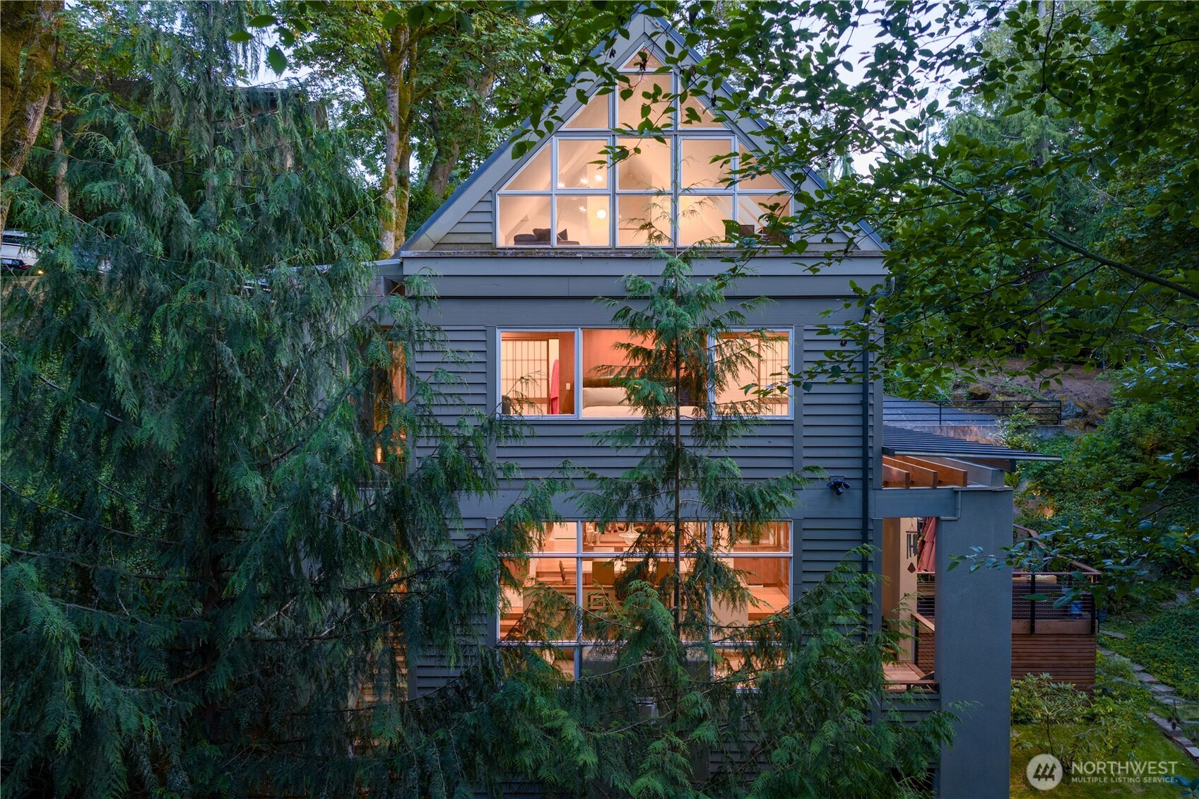 Enjoy dramatic architecture and soaring ceilings in this striking Northwest modern home.