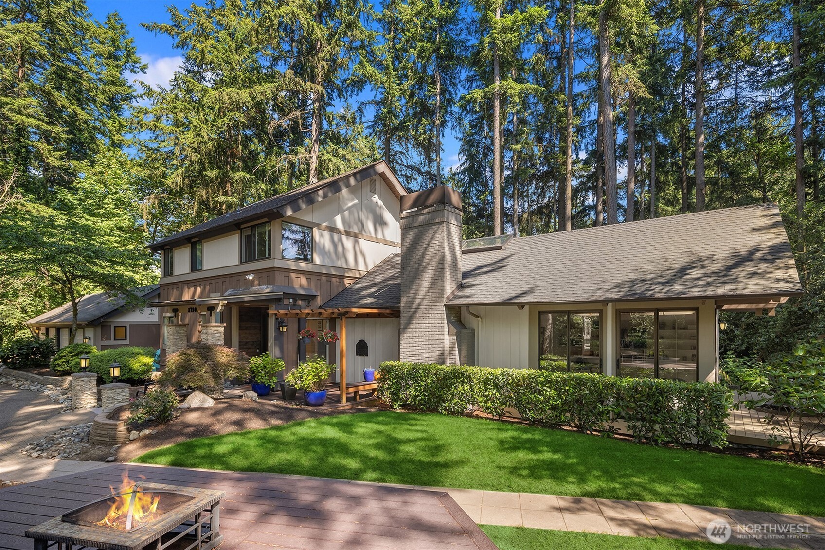 Every angle, the exterior is a Bridle Trails park like dream.