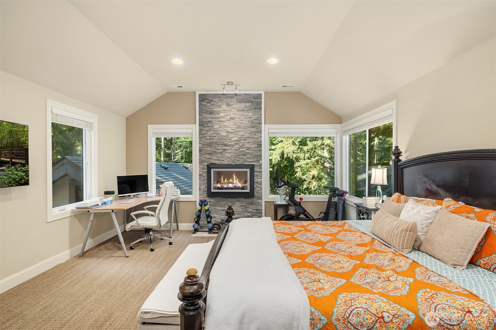 Welcome to the private primary suite. Fit with coffee/winebar, five piece bathroom, soaring ceilings and windows peaking at treetops, as if you are floating in peaceful romance.