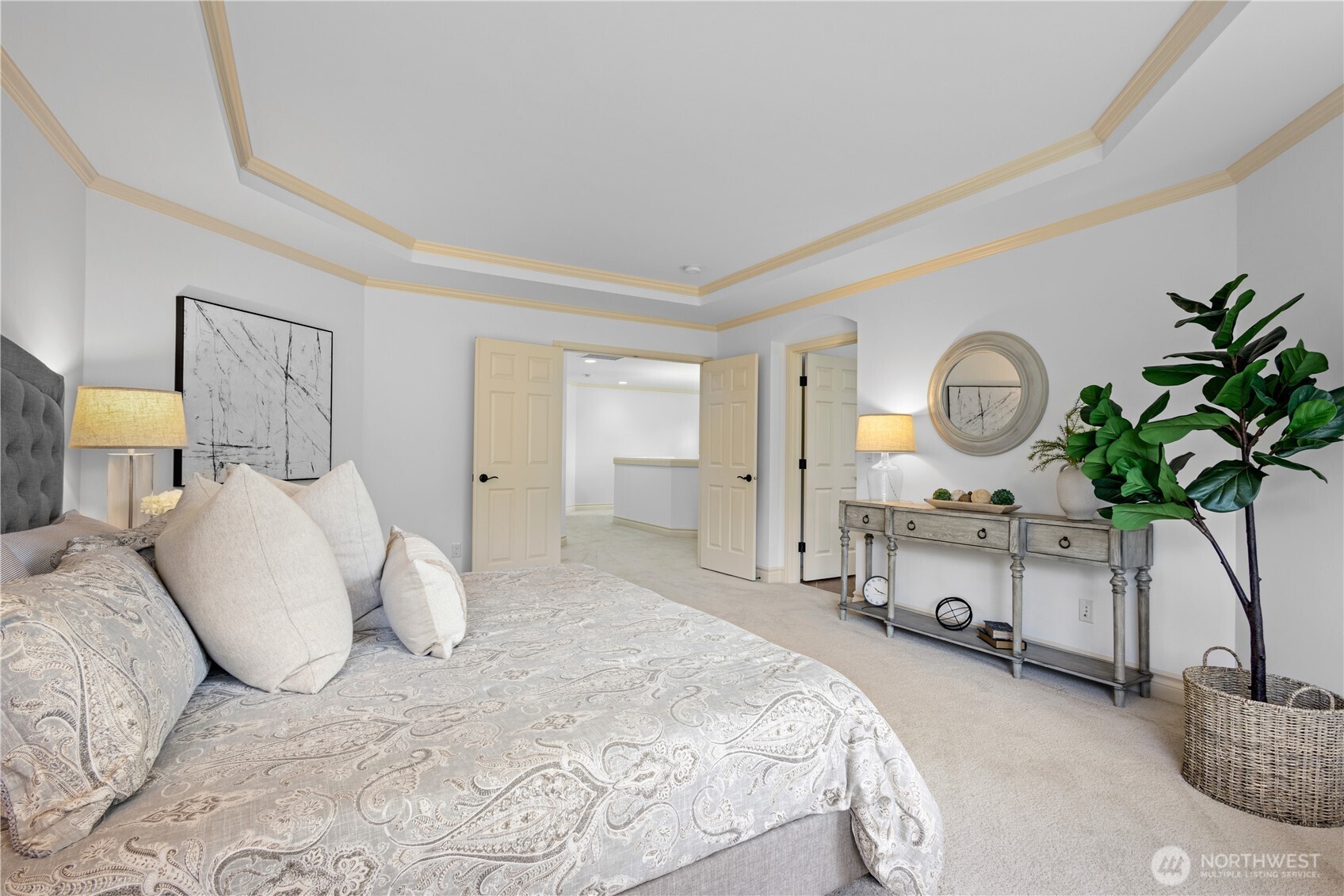 Double door entry to the primary bedroom complete with private bath and walk-in closet.