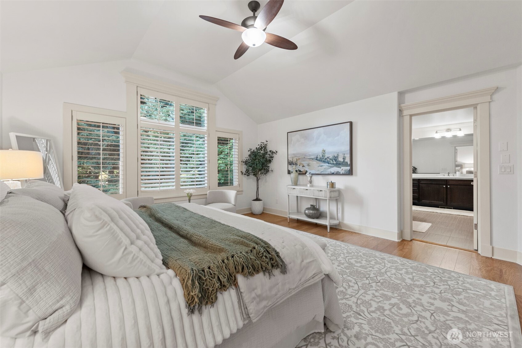 Primary bed suite with hardwood floor