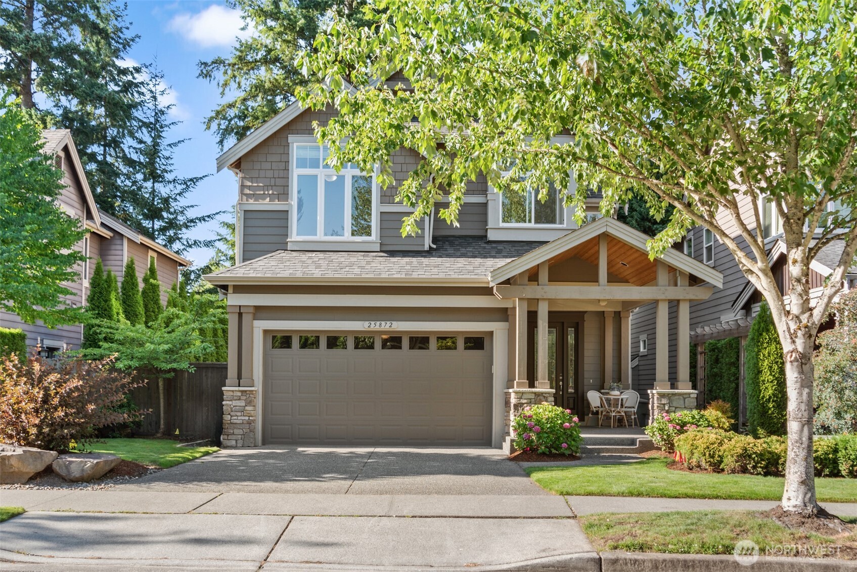 A covered front porch with timber beams adds character and a welcome touch, for coffee or relaxation