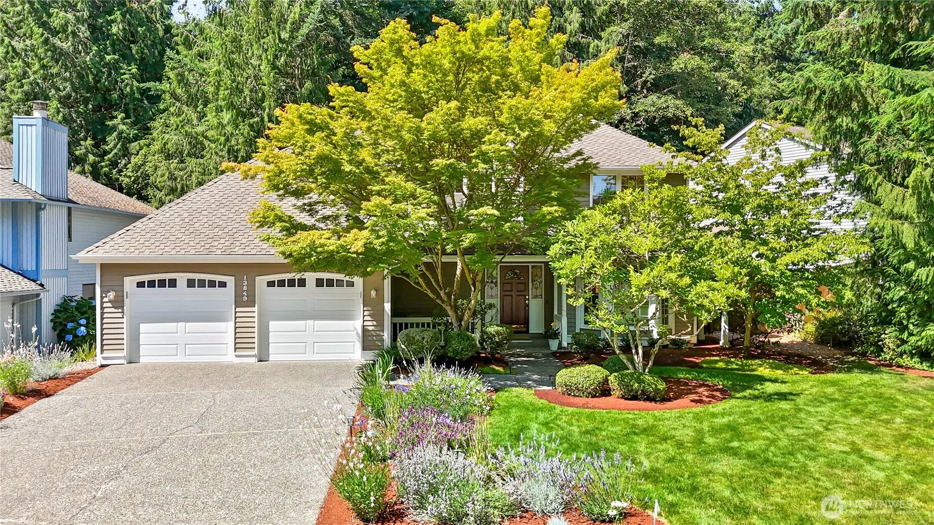 Incredible curb appeal with professionally landscaped front yard.