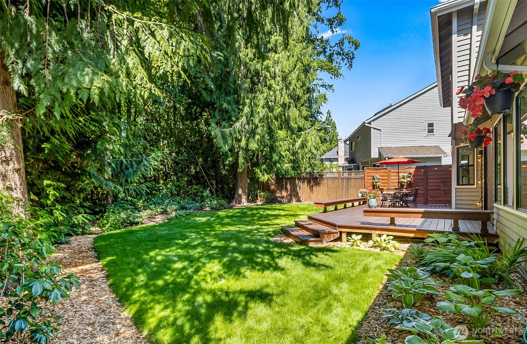 Flat, private back yard with lush landscaping, garden space and loads of sunlight year round.