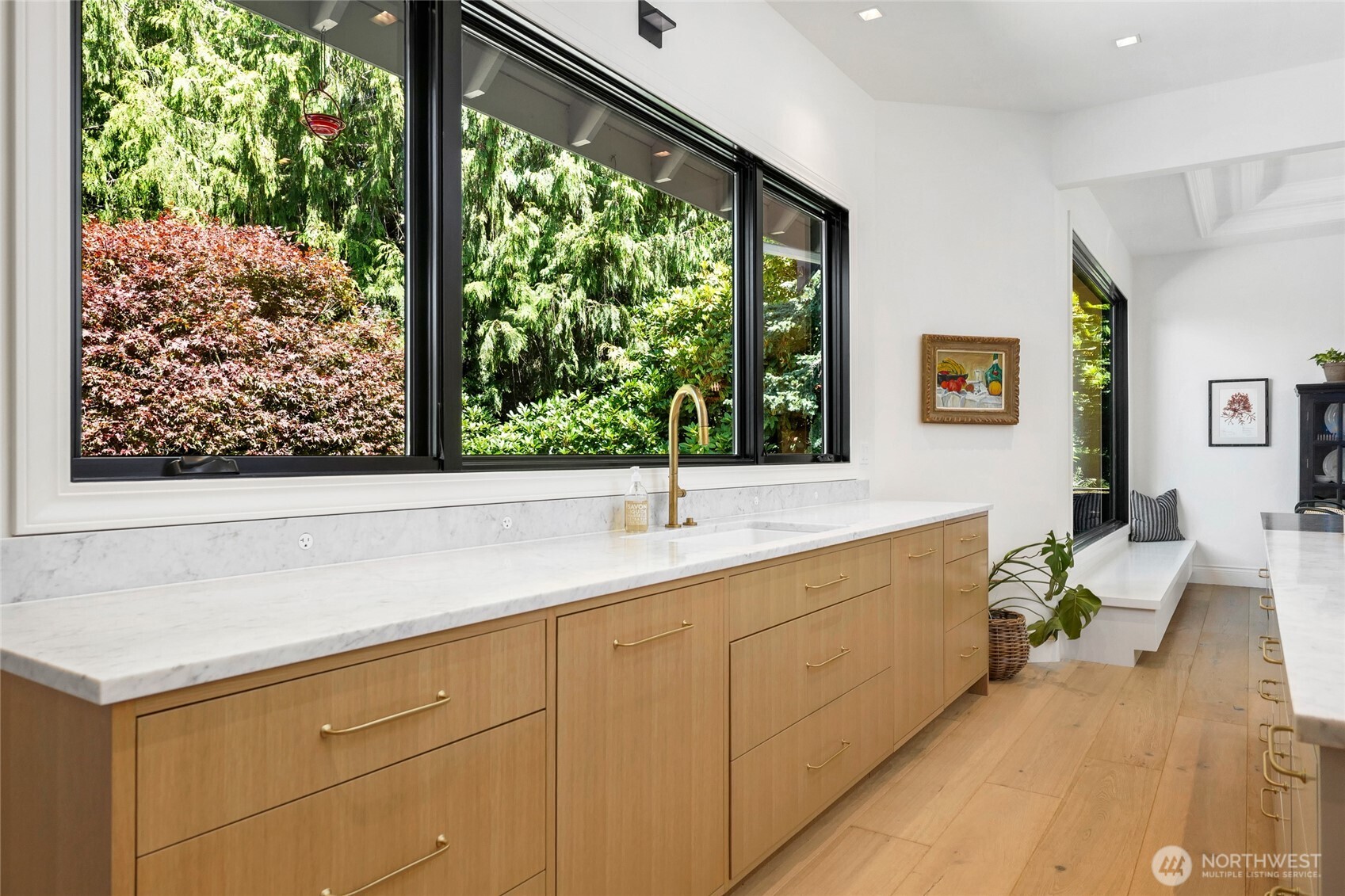 Spacious countertop space and an oversized sink, with convenient sleek Bocci electrical outlets for a clean, and modern look.