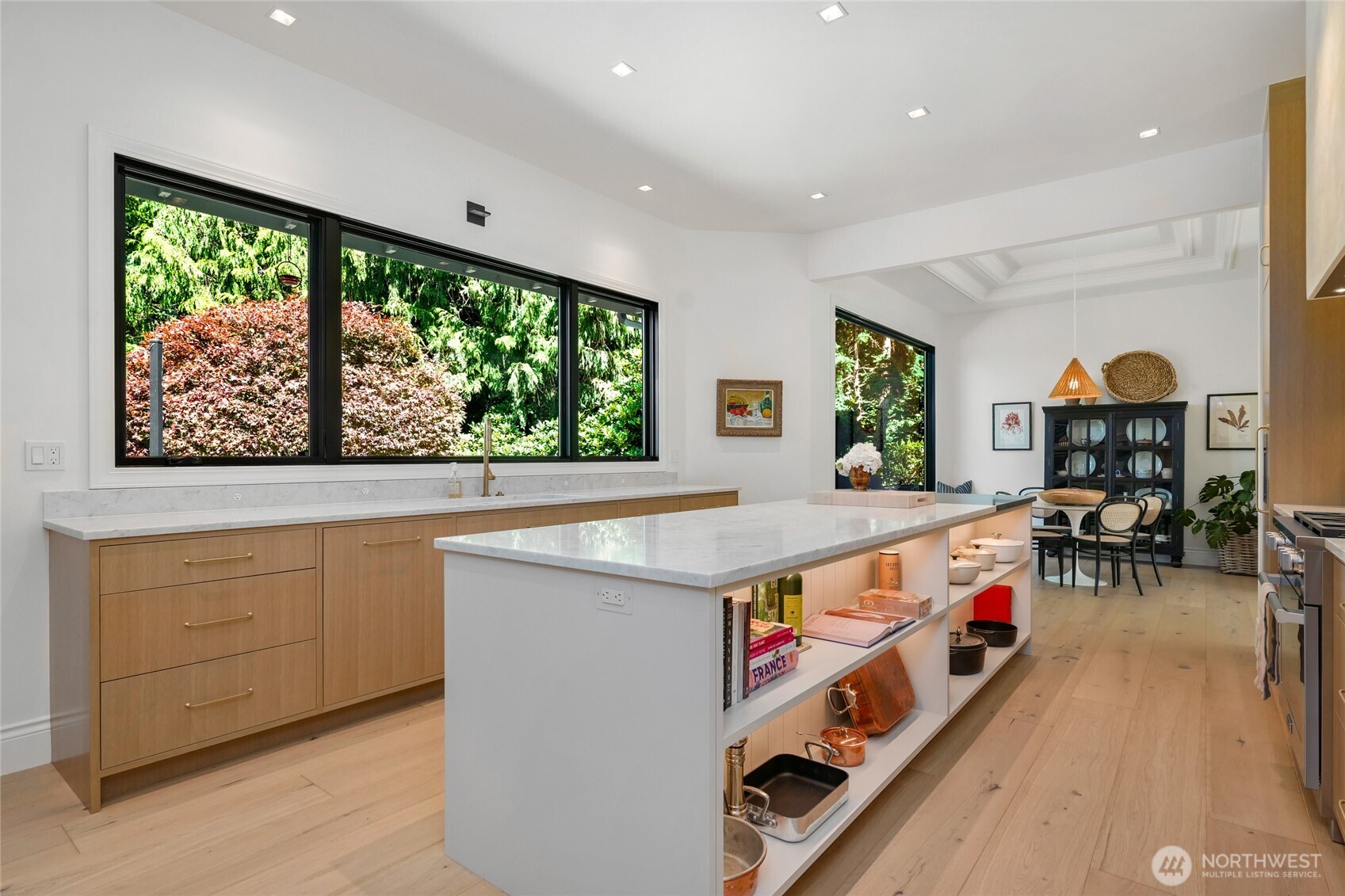 Ample drawer storage, open shelving, and sleek under-cabinet lighting for easy access to everything you could need in the kitchen!