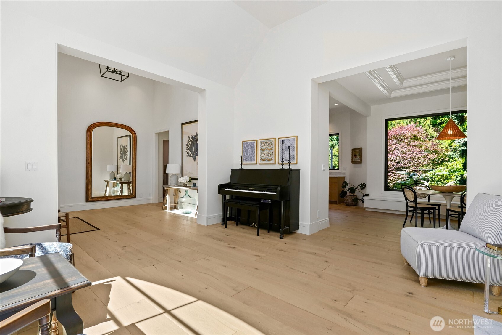 Bright and airy open-concept layout with seamless transitions from formal living to dining and kitchen spaces.