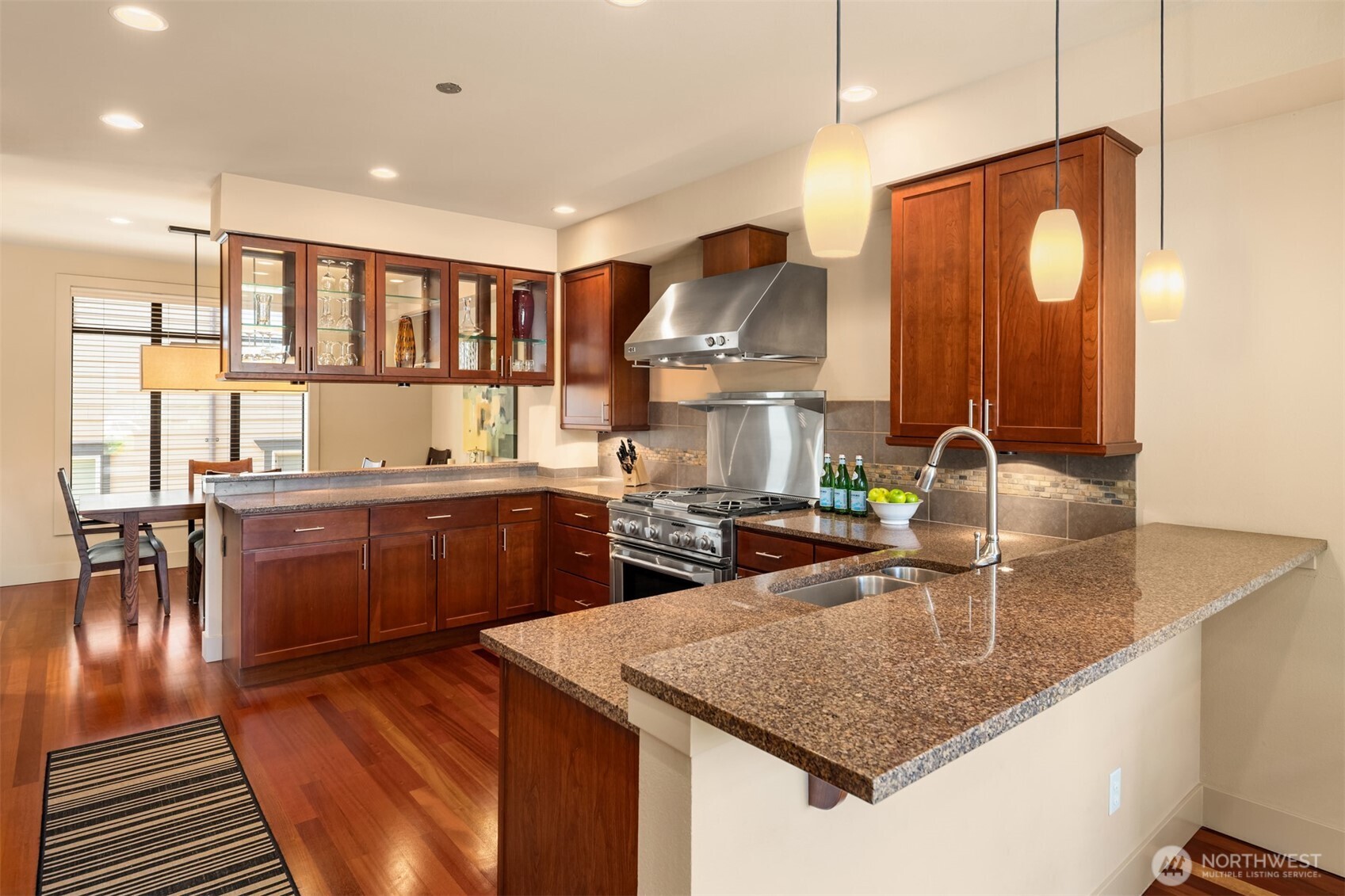 GE Monogram appliances - including built-in fridge and 6 burner gas range.