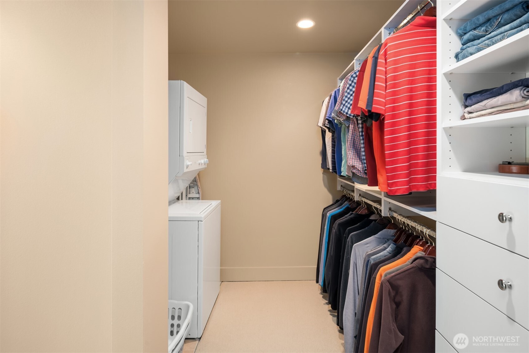 Closet features washer and dryer, for ultimate convenience.