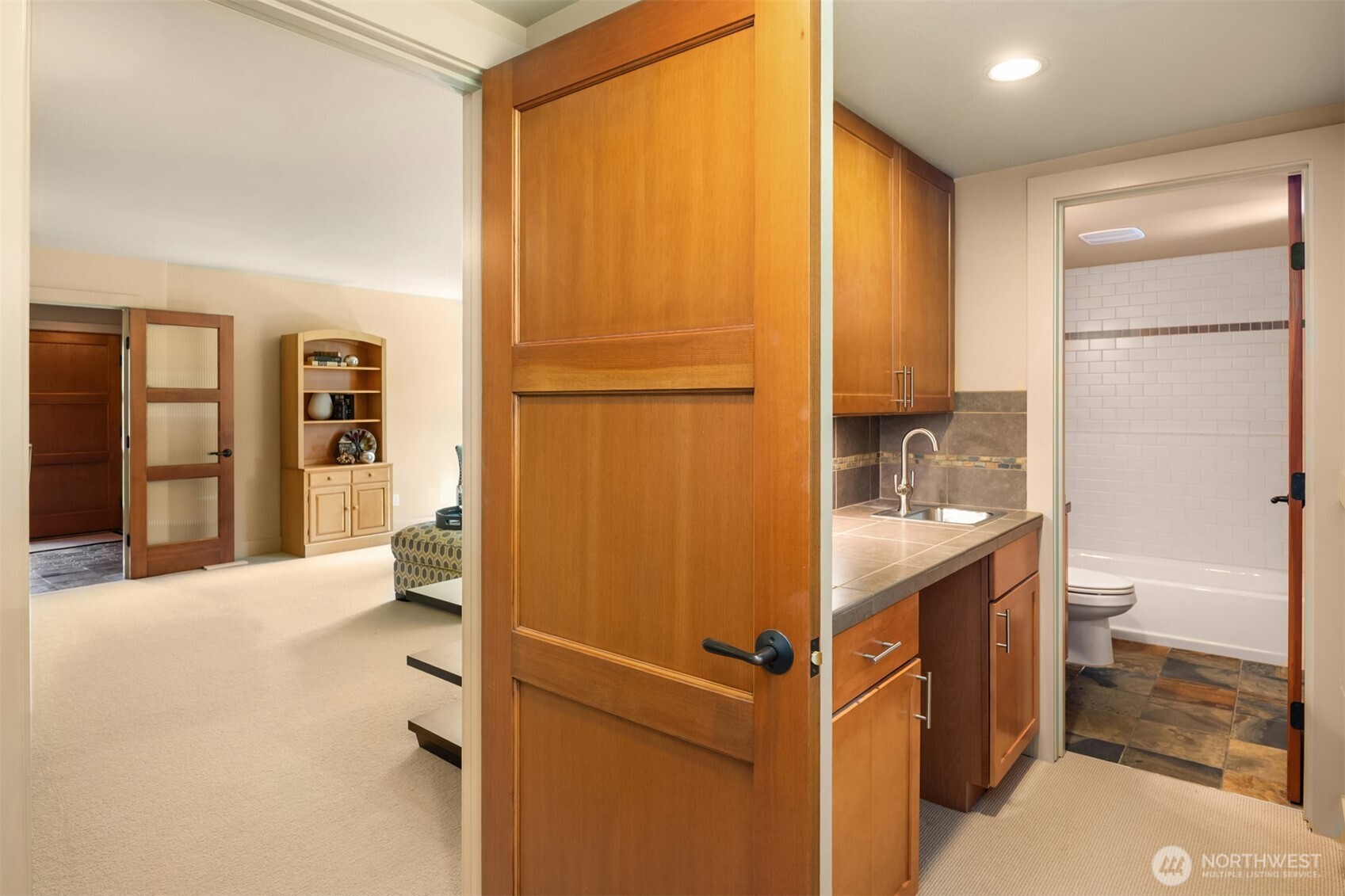 Bonus leads to the full bathroom, wet bar, and plenty of space for a dresser and closet - or even perhaps an office.
