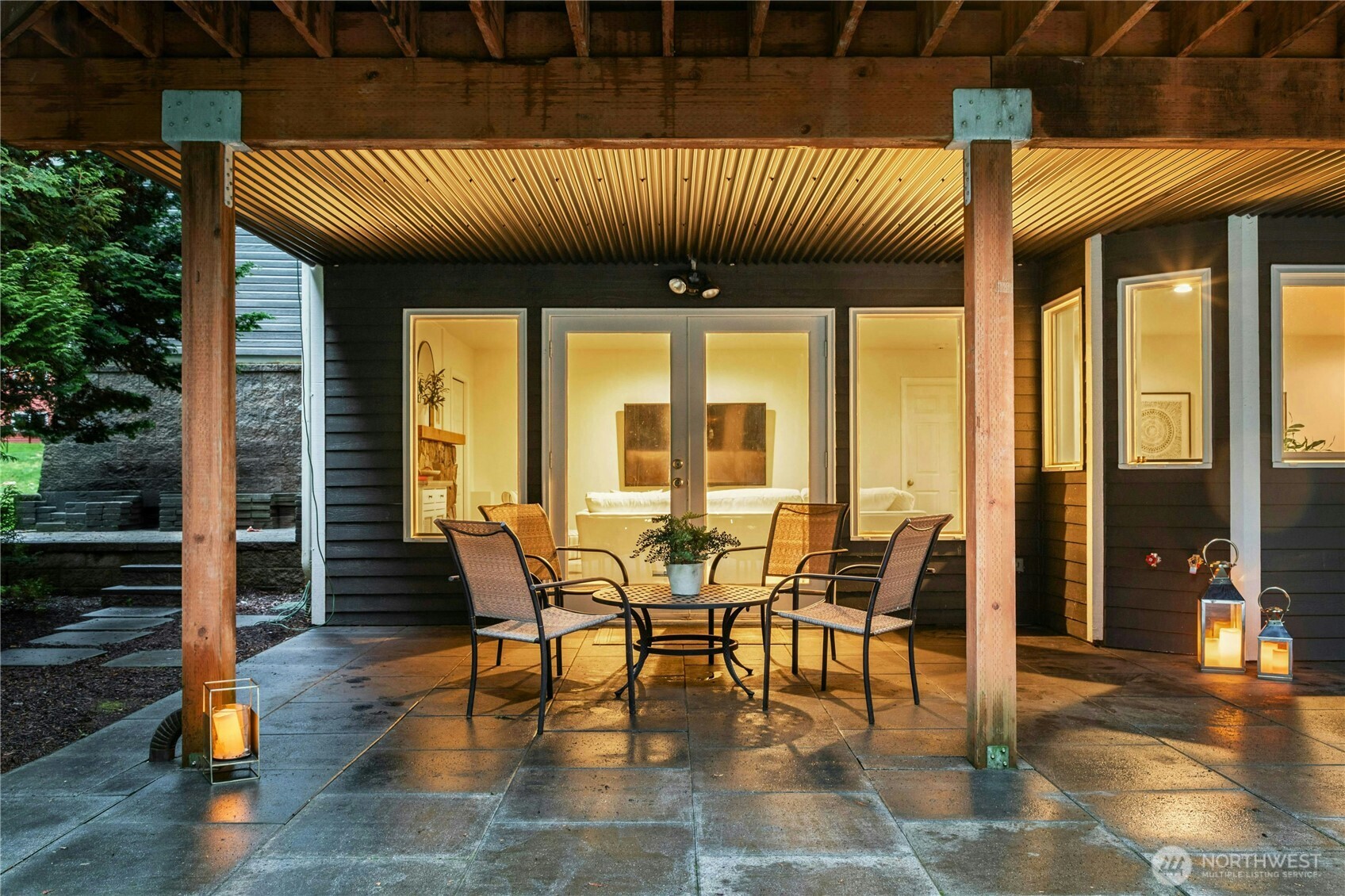 French doors from the lower level lead to a gorgeous covered paver patio for relaxing evenings, dining al fresco.