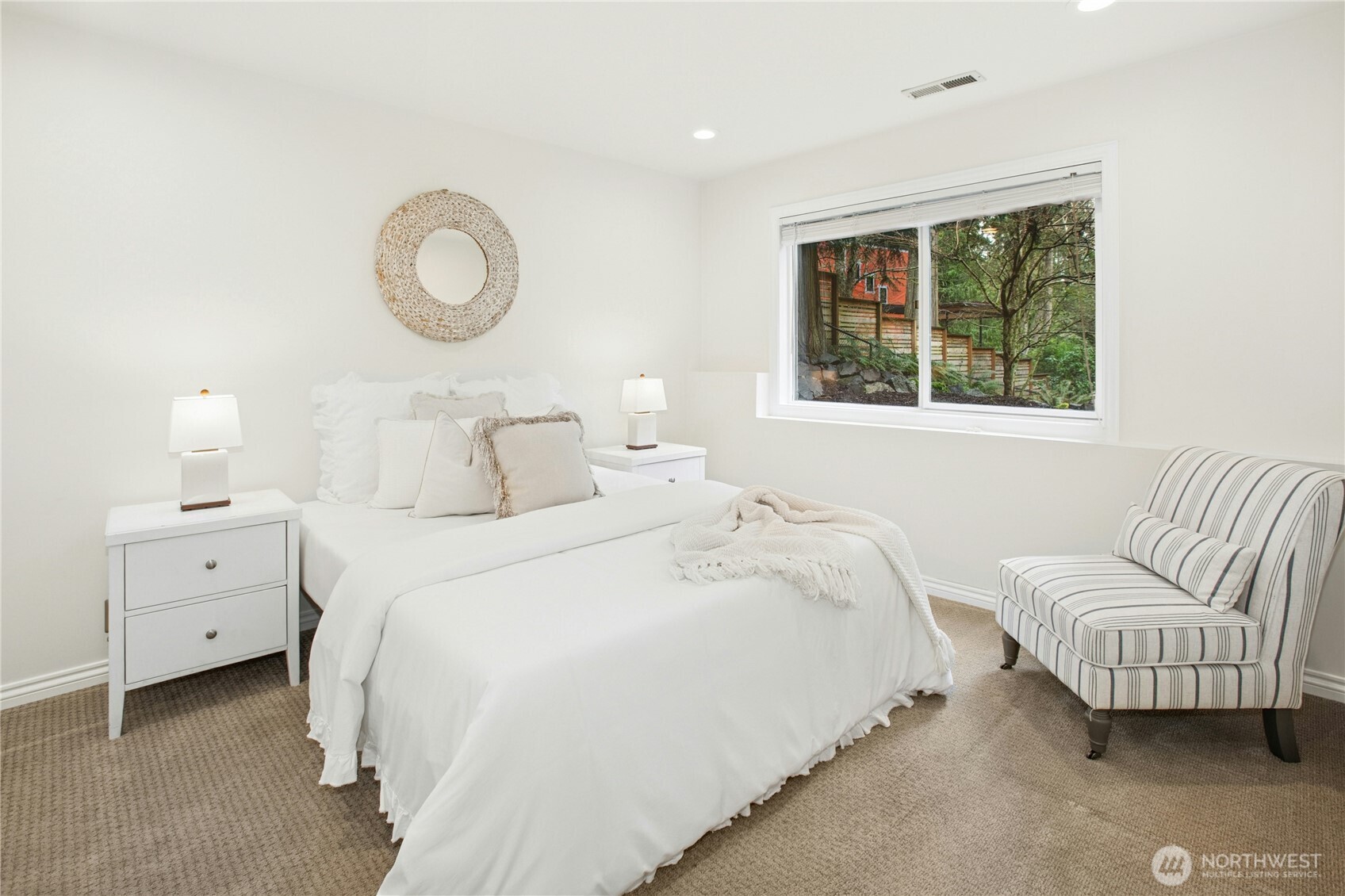 Bright and tranquil lower-level bedroom - ideal for guests, multi-gen living, or home office, just steps from the beautifully remodeled ¾ bath.