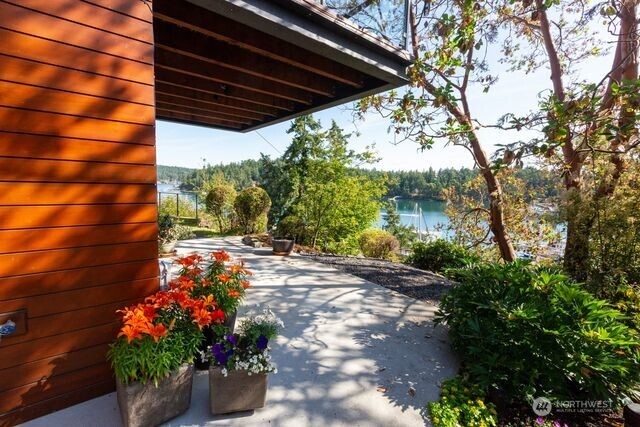 Patio area off ground floor TV family room with view of harbor.