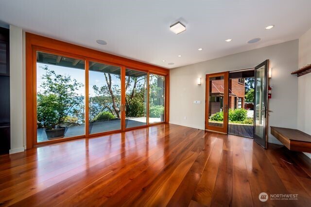 Ground level TV room with views. Exit to courtyard that leads over to the detached guest apartment.