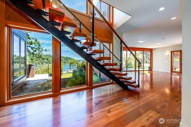 Custom Stairs from bonus room to main level above or take the built-in elevator.