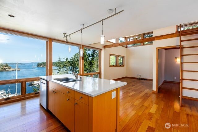 Guest apartment has kitchen, living room, bedroom plus a loft above bedroom and a 3/4 bath.