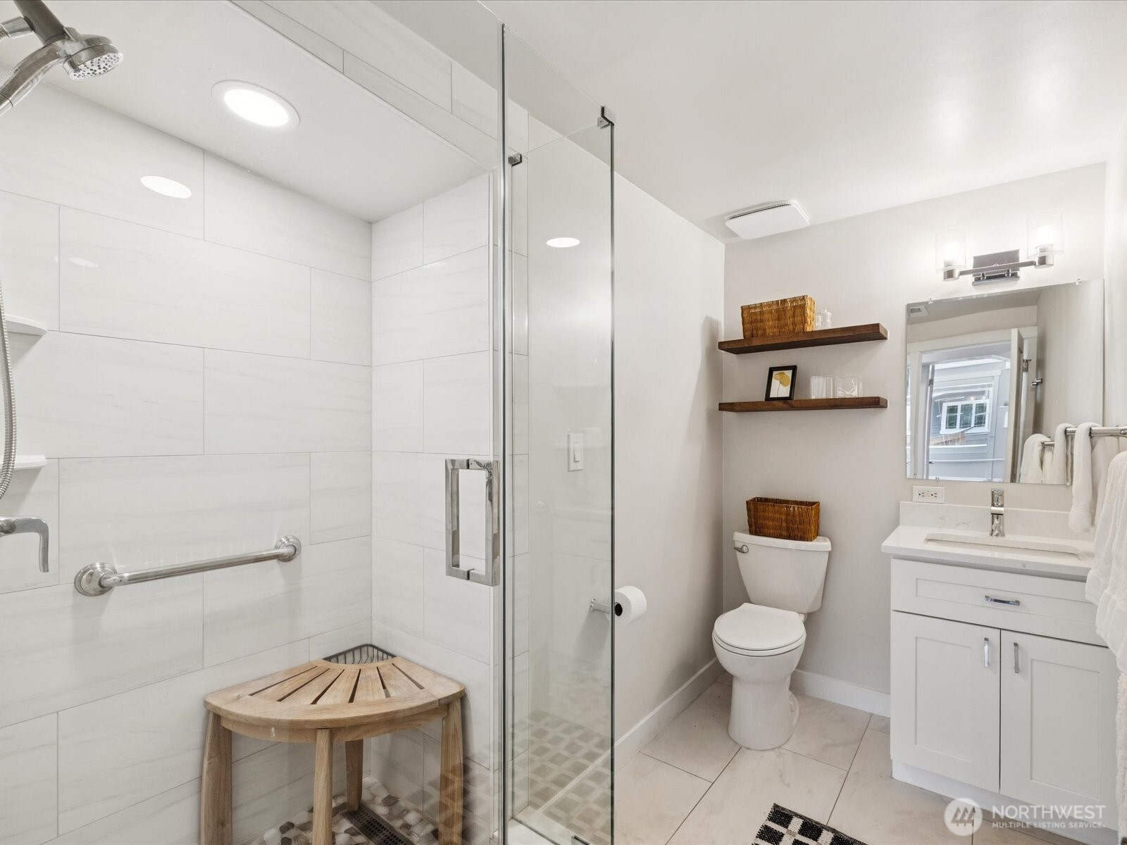 3/4 bathroom with spa-like shower located across from bedroom #4 next to stair landing