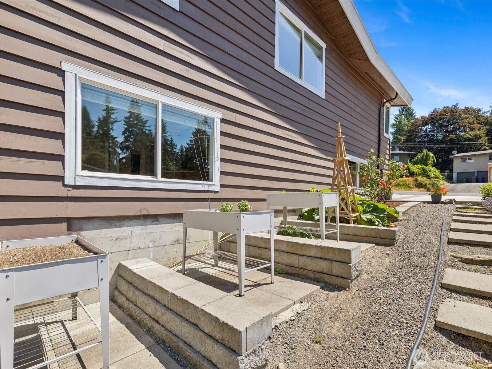 View of existing raised planters along S elevation of home